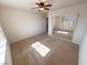 Bright bedroom with mirrored closet doors and ceiling fan at 2080 Mount Charleston Dr, Pahrump, NV 89048