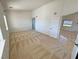 Spacious bedroom with high ceilings, neutral carpet and access to other rooms at 2080 Mount Charleston Dr, Pahrump, NV 89048