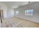 Bright bedroom featuring large windows and neutral carpet, providing a serene space at 2080 Mount Charleston Dr, Pahrump, NV 89048