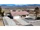 Inviting single-story home with well-maintained landscaping and mountain views at 2080 Mount Charleston Dr, Pahrump, NV 89048