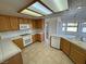 Open kitchen featuring tile countertops, oak cabinets, and seamless connection to the dining area at 2080 Mount Charleston Dr, Pahrump, NV 89048