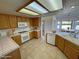 Well-lit kitchen with tile countertops, breakfast nook, and modern appliances at 2080 Mount Charleston Dr, Pahrump, NV 89048