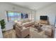 Cozy living room featuring comfortable furniture and abundant natural light at 2080 Mount Charleston Dr, Pahrump, NV 89048