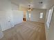 Carpeted main bedroom with windows and access to the bathroom at 2080 Mount Charleston Dr, Pahrump, NV 89048