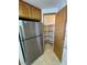 A walk-in pantry featuring shelves, adjacent to a stainless steel refrigerator at 2080 Mount Charleston Dr, Pahrump, NV 89048