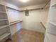 Walk-in closet with shelving and tile flooring at 2080 Mount Charleston Dr, Pahrump, NV 89048