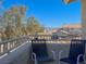 Scenic balcony view with seating, overlooking the desert landscaping and mountains at 2194 Camel Mesa Dr, Laughlin, NV 89029