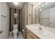 Cozy bathroom with patterned wallpaper, a well-lit vanity, and tile flooring at 2194 Camel Mesa Dr, Laughlin, NV 89029