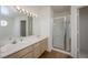 Spacious bathroom with dual sinks, large mirror, and a separate shower stall at 2194 Camel Mesa Dr, Laughlin, NV 89029