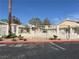 A community street view featuring attractive landscaping and homes with red tile roofs at 2194 Camel Mesa Dr, Laughlin, NV 89029