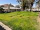 The exterior of the property shows a green lawn, neutral color stucco, and a red tile roof at 2194 Camel Mesa Dr, Laughlin, NV 89029