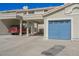 Two-story home features private carport, attached garage, and desert landscaping at 2194 Camel Mesa Dr, Laughlin, NV 89029