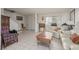 Inviting living room featuring tile floors, a comfortable seating arrangement, and natural light at 2194 Camel Mesa Dr, Laughlin, NV 89029