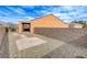 Low-maintenance backyard with gravel, a covered patio, and privacy wall, ideal for easy living at 2204 Bay Thrush Way, North Las Vegas, NV 89084