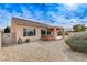 Well-maintained backyard featuring a hot tub, gravel, and covered patio perfect for outdoor relaxation at 2204 Bay Thrush Way, North Las Vegas, NV 89084