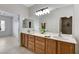 Bathroom featuring double sinks, granite countertops, and access to ensuite bedroom at 2204 Bay Thrush Way, North Las Vegas, NV 89084