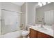 Bathroom featuring a shower-tub combo, toilet, and vanity with a mirror at 2204 Bay Thrush Way, North Las Vegas, NV 89084