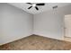 Bedroom showcasing tile flooring, a ceiling fan, and neutral paint at 2204 Bay Thrush Way, North Las Vegas, NV 89084