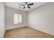 Bedroom featuring carpet, a ceiling fan, and a bright window at 2204 Bay Thrush Way, North Las Vegas, NV 89084