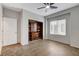 Comfortable bedroom with a built-in bookcase and ceiling fan at 2204 Bay Thrush Way, North Las Vegas, NV 89084