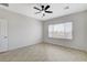 Bright bedroom featuring a ceiling fan, neutral walls and tile flooring at 2204 Bay Thrush Way, North Las Vegas, NV 89084