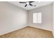 Bedroom showing carpet, a ceiling fan, and a bright window at 2204 Bay Thrush Way, North Las Vegas, NV 89084