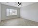 Bright bedroom featuring a ceiling fan, neutral walls and tile flooring at 2204 Bay Thrush Way, North Las Vegas, NV 89084