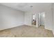 Spacious carpeted bedroom with an ensuite bathroom and walk-in closet at 2204 Bay Thrush Way, North Las Vegas, NV 89084