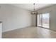 Bright dining room features tile flooring, and a sliding glass door that provides access to the backyard at 2204 Bay Thrush Way, North Las Vegas, NV 89084