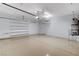 Spacious garage with epoxy floor, shelving, and lighting, offering ample storage and functionality at 2204 Bay Thrush Way, North Las Vegas, NV 89084