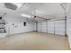 Spacious garage with epoxy flooring and overhead storage racks at 2204 Bay Thrush Way, North Las Vegas, NV 89084