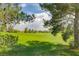 Expansive, well-manicured golf course framed by lush trees and blue skies at 2204 Bay Thrush Way, North Las Vegas, NV 89084