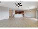 Spacious living area featuring tile flooring, ceiling fan and an open floor plan concept at 2204 Bay Thrush Way, North Las Vegas, NV 89084