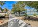 Scenic walkway to tennis courts framed by landscaped foliage at 2204 Bay Thrush Way, North Las Vegas, NV 89084