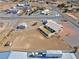 Aerial view of the property's layout featuring a home, expansive backyard, and detached garage at 240 Ember St, Pahrump, NV 89048