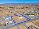 Aerial shot of a desert property highlighted within a blue border and mountainous backdrop at 240 Ember St, Pahrump, NV 89048