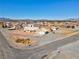 Aerial view of a residential area with custom homes and desert landscaping at 240 Ember St, Pahrump, NV 89048