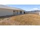 Large backyard featuring lawn and a covered patio at 240 Ember St, Pahrump, NV 89048