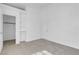 Bedroom with neutral carpet, ample natural light, closet and shelving at 240 Ember St, Pahrump, NV 89048