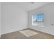 Bedroom featuring neutral carpet and a window that lets in plenty of natural light at 240 Ember St, Pahrump, NV 89048