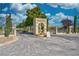 Sanders Winery entrance featuring a beautiful fountain, lush landscaping, and a welcoming gate at 240 Ember St, Pahrump, NV 89048