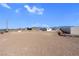 Large, bare land featuring surrounding homes in neighborhood at 240 Ember St, Pahrump, NV 89048