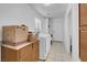 Laundry area complete with tile floor, washer and dryer and laminate countertop at 240 Ember St, Pahrump, NV 89048