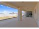 Covered patio with concrete floor and sliding glass doors to the house at 240 Ember St, Pahrump, NV 89048