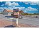 Artesian Cellars entrance with a sign, barrels, vineyard views, and space for wine tastings at 240 Ember St, Pahrump, NV 89048