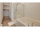 Bathroom featuring a tiled shower and tub combination and a large walk-in closet at 25 Barbara Ln # 67, Las Vegas, NV 89183