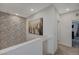 Upstairs hallway with textured wall accents, recessed lighting, and access to bedrooms at 25 Barbara Ln # 67, Las Vegas, NV 89183