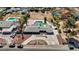 Aerial view of a landscaped property with a pool, outdoor living spaces, and mature landscaping at 2711 Ashby Ave, Las Vegas, NV 89102