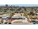 Expansive aerial view of a landscaped home featuring a pool, circular driveway and desert landscaping at 2711 Ashby Ave, Las Vegas, NV 89102