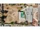 An aerial perspective showcasing the entire property with a large lot, pool, and an adjacent vacant lot at 2711 Ashby Ave, Las Vegas, NV 89102